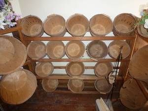 wood display that holds 15 smaller baskets for silk flowers, vegies, whatever