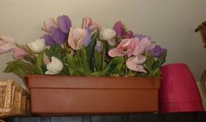 spring flower arrangement in planter and 2 bright pink planters