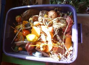 tote of fall decorations for flower arrangements