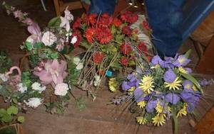 3 flower arrangements in containers