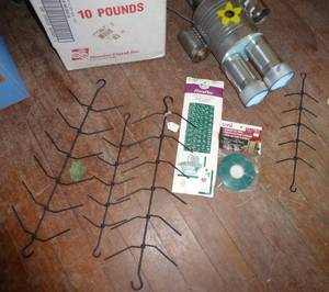 box of fake grass, hangers, tin man