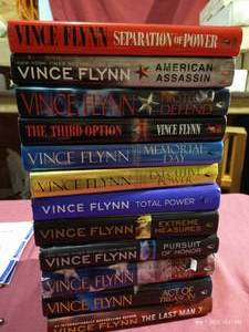 lot 100 image: (12) Vince Flynn Hardcover Books