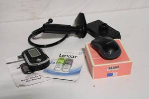 lot 3 image: Tech Gadget Bundle Sonix Bluetooth Speaker, Breath Alcohol Tester, Lexar USB Drives, and More