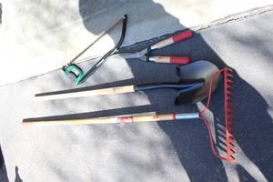 lot 37 image: Set of 4 Gardening Tools Including Rake, Shovel, Shears, and Handsaw