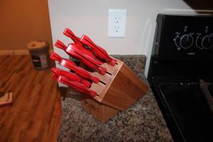 lot 70 image: Cutco Knife Set with Wood Block and Red Handles
