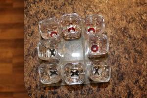 lot 91 image: Tic-Tac-Toe Drinking Game Set with 9 Shot Glasses and Glass Board