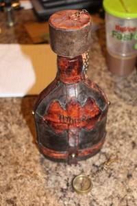 lot 96 image: Antique Leather Wrapped Whisky Flask with Brass Compass Charm