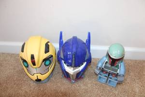 lot 124 image: Set of 3 Character Helmets Bumblebee, Optimus Prime, and Boba Fett