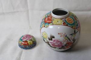 lot 61 image: Exquisite Hand-Painted Porcelain Vase with Lid Featuring Vibrant Floral Patterns