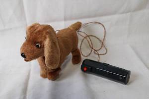 lot 63 image: Vintage Battery-Operated Walking Plush Dog Toy with Remote