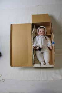lot 129 image: Nicholas Winter Baby Doll by Ashton-Drake Galleries with Original Packaging