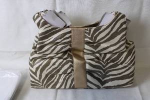 lot 146 image: Stylish Zebra Print Handbag with Gold Accents
