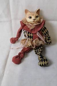 lot 149 image: Vintage Harlequin Cat Doll with Lace and Diamond Pattern Clothing