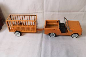 lot 197 image: Vintage Orange Toy Jeep with Trailer