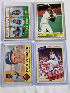 lot 86 image: Lot of 4 Vintage Baseball Cards - 1971 RBI Leaders No. 87, Willie McCovey 1979 No. 215, Don Zimmer 1960 No. 47, Dennis Eckersley 1980 No. 320
