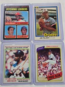 lot 171 image: Lot of 4 Vintage Topps Baseball Cards - Willie McCovey 77 Record Breaker No. 3, 1970 National League Pitching Leaders wBob Gibson No. 70, Dennis Eckersley 1980 No. 320, Jim Palmer 1981 No. 353
