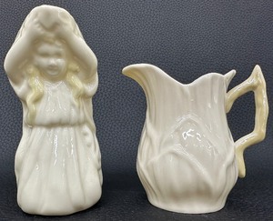 lot 85 image: A Lovely Pair of Belleek Creamers - Undine Irish Sea Nymph & Leaf Pattern Both with Yellow Lustre