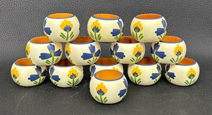 lot 153 image: Thirteen Wooden Floral Napkin Rings