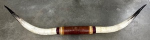 lot 11 image: Make a Statement with these Very Large Decorative Hanging Steer Horn  76 Wide Steer Horns  Leather Wrapped Long Horns