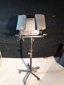 lot 90 image: TV with stand and DVDs for karaoke