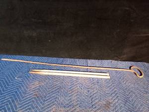 lot 92 image: Fire place poker and 2 steel horseshoe stakes