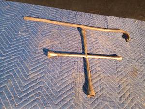 lot 93 image: Crow bar and 4-way wrench