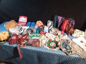 lot 247 image: New socks, first aid kit, doilies, musical Birthday picture, Hats, gloves, curling wands, 2 umbrellas and more
