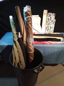 lot 238 image: Large garbage can with lid full of bulk material, skirt pin type marker and 2 umbrellas
