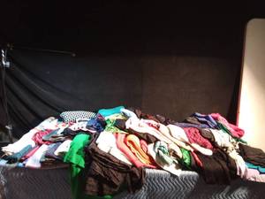 lot 232 image: 2 boxes and lg bag of smoke free polyester, velour, and other stretchy material