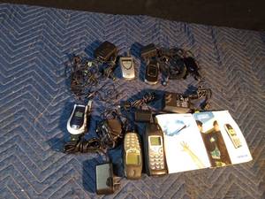 lot 161 image: Vintage cell phones, ear buds and chargers
