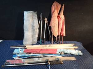 lot 141 image: Pail of misc. - Pressure washer wand, lg bolt, 2 pruners, flags, screen, door bottom seal, and dowels