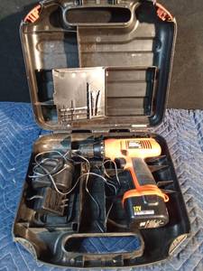 lot 137 image: 12V Black Decker Fire Storm drill with charger, bits and battery in case
