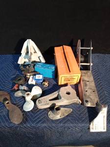 lot 109 image: Boat parts - propellers, anchor hitch, fuel pump, anchor roller, muffler, and more
