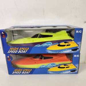 lot 13 image: Lot Of Two RC High Speed Boats Bright GreenPurple Bright OrangeGreen