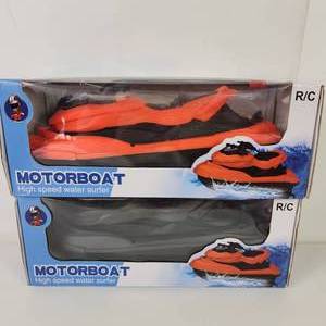 lot 14 image: Lot Of Two RC Motor Boats High Speed Water Surfers OrangeBlack And Black New