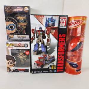 lot 34 image: Nerf Game Transformers Ms. Marvel Pin And Ghostbuster Pop New