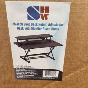 lot 42 image: 36-Inch Over Desk Height Adjustable Desk With Monitor Riser, Black MSRP $199