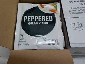 lot 113 image: 24 ct 1.25 oz Bags Peppered Gravy M...