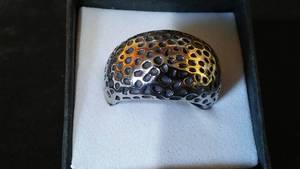 lot 978 image: Metal Ring with Spotted Design.