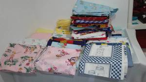 lot 759 image: Flannel, Cotton, Some are cut for blankets, Remnant Material, in Covered Tote