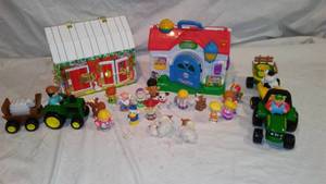 lot 448 image: Fisher Price Barn, Melissa and Doug Barn, John Deere Tractors, and Little People.