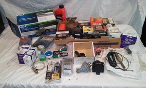 lot 456 image: Oil Filters, Oil Can, Tow Car Windshield Protector and more.