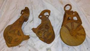 lot 466 image: Antique Cast Iron Trolly Pullies(3).
