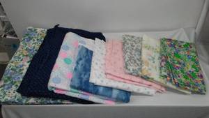 lot 879 image: Cotton, Flannel, and Jersey in Covered Tote.