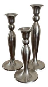 lot 37 image: Set of Three Brushed Silver Decorative Candle Holders