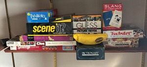 lot 412 image: Games Galore including Scene It, Pictionary, Slang Flashcards, Banana Grams, Twister and More