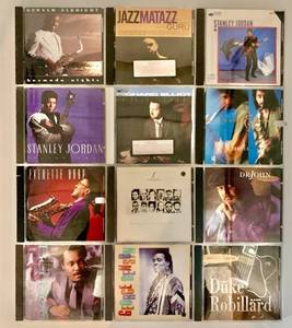 lot 160 image: Collection of 12 Jazz CDs Featuring Gerald Albright, Stanley Jordan, and More