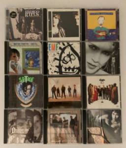 lot 303 image: Collection of 12 Assorted Music CDs