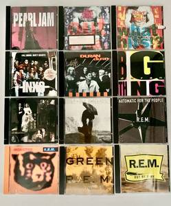 lot 307 image: Collection of 12 Classic Rock CDs Featuring Pearl Jam, R.E.M., and INXS
