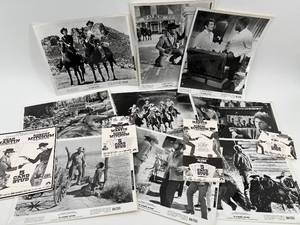 lot 517 image: Collection of 13 5 Card Stud Movie Stills Featuring Dean Martin and Robert Mitchum